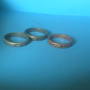 Set of 3 peace, love, luck rings in size 7